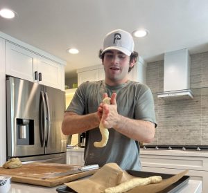 Alex Weinstein (12) rolling the dough for his challah business. Photo courtesy of Alex Weinstein