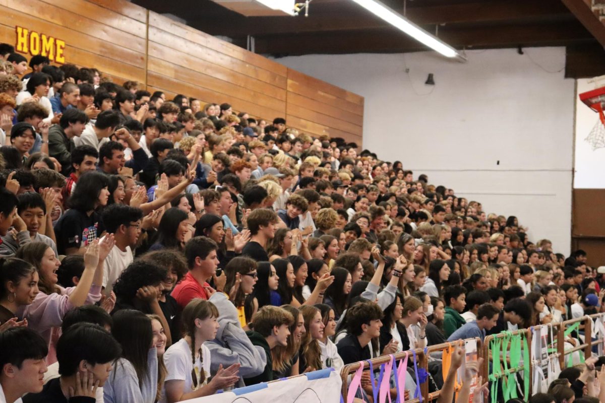 The senior and freshman sections cheered on John Prior (12) after his opening speech. 