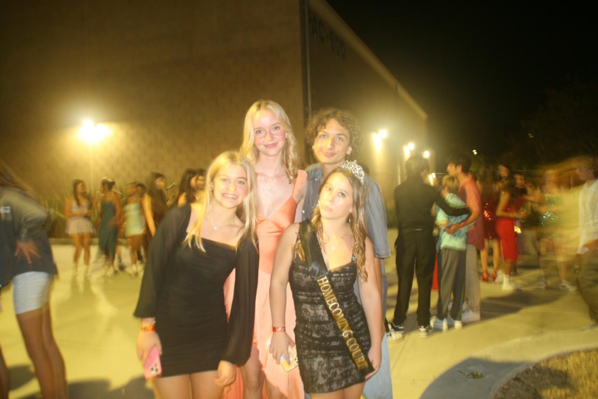 Left to right: Kennedy Wilkinson (9), Kingsley Romande (9), Christopher Bacon (9) and homecoming princess Nina Speer (9) arrive dressed up and ready to enjoy the dance. The dance took place on Saturday. 