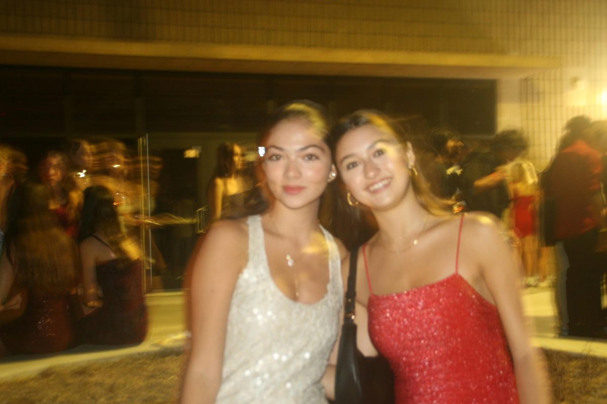 Left to right: Amelia Mazo (10) and Isabella Velasco (9) converse in the PAC quad, where the dance took place. The dance was located on campus this year. 