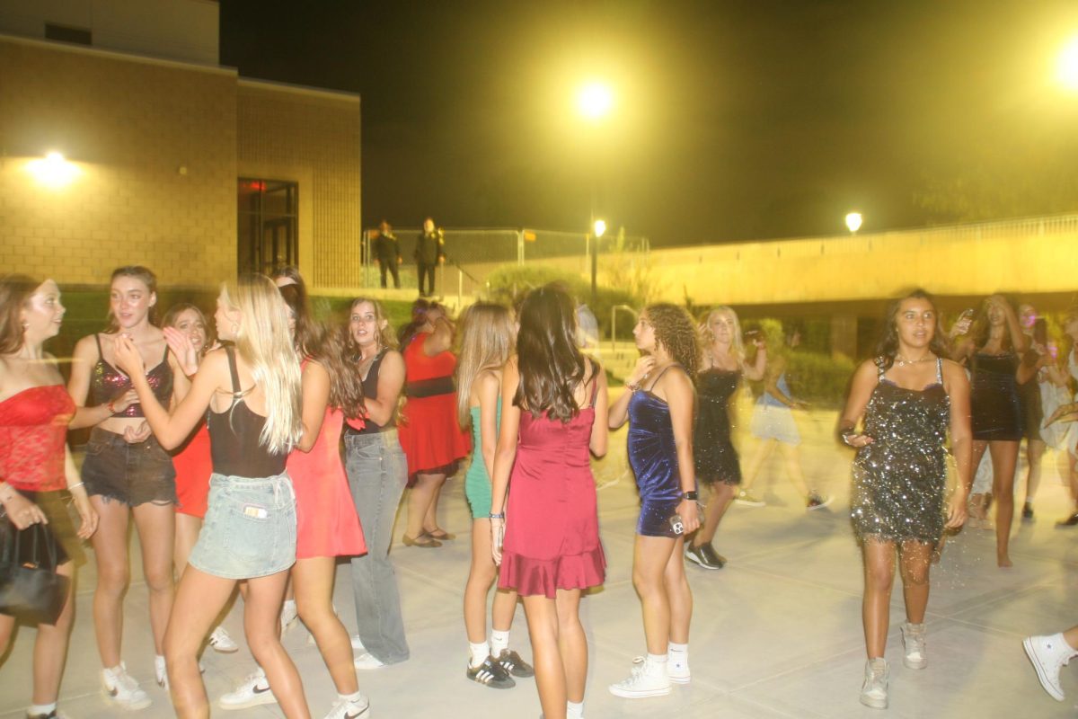 Students take to the dance floor throughout the event. They expressed  themselves to the beat of the music.