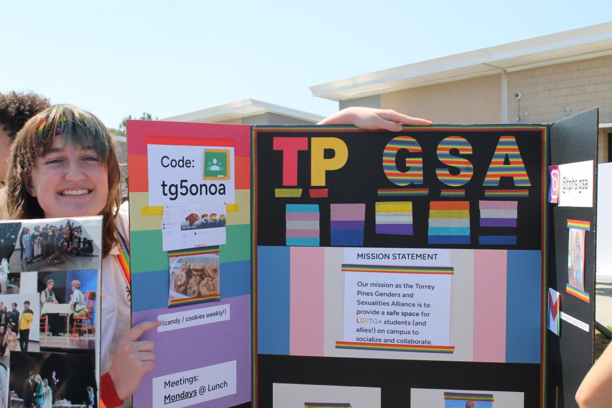 Stanley McInnis (11) smiles by the TPHS Gender and Sexuality Alliance booth.