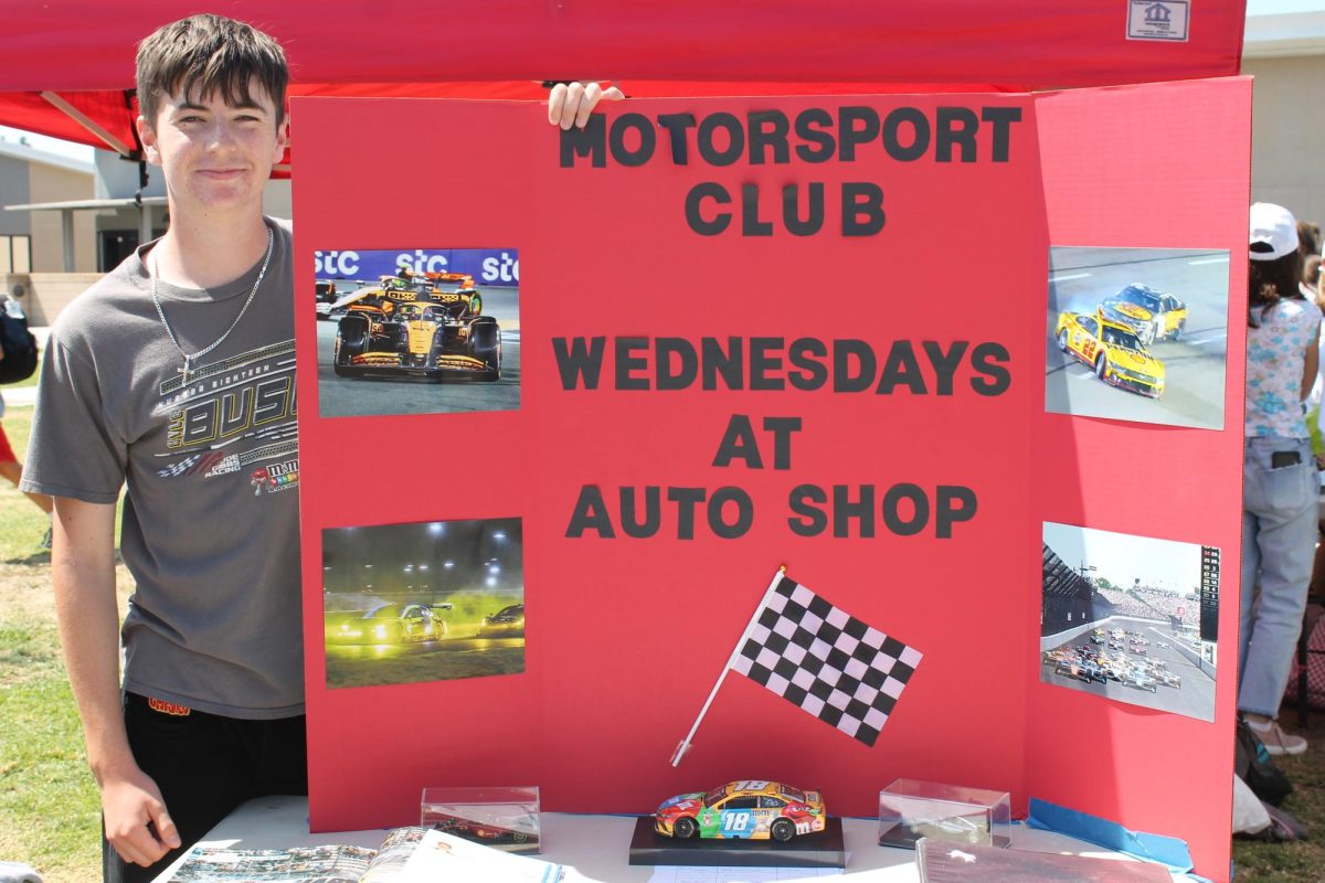 Daniel McKie (10) promotes the Motorsports Club.