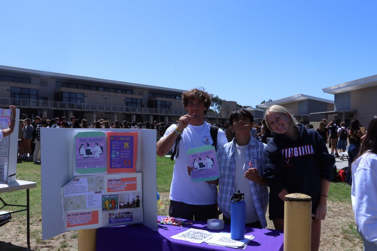 Best Buddies fosters connections and unites fellow students with cognitive and developmental disabilities, aiming to create an inclusive community. They promoted their club at club rush. Left to Right: Joey Levenberg (12), Jacob Cava (12), Harper Kelley (12). 
