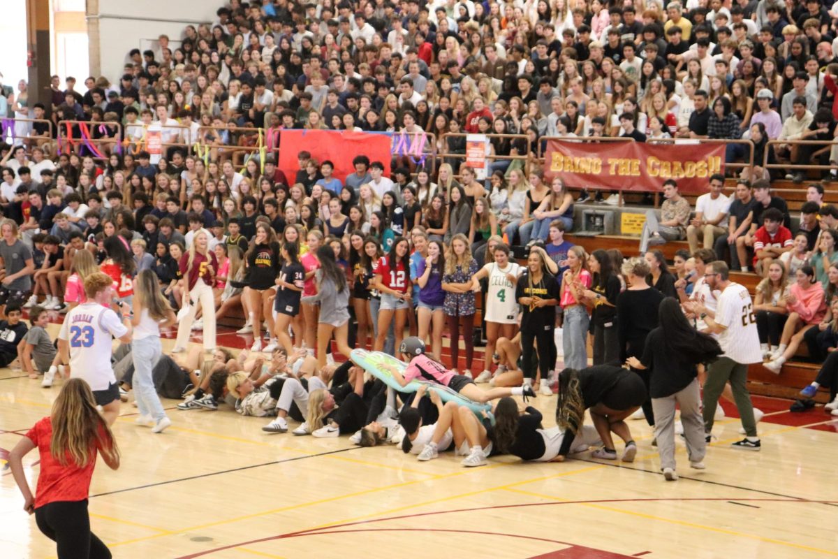 One of this years fun games had students carrying one of their peers across a 'human bridge.'