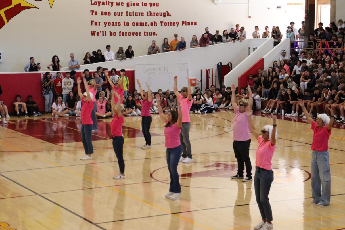 Multiple teachers choreographed a dance routine to the song 'Hot To Go!'