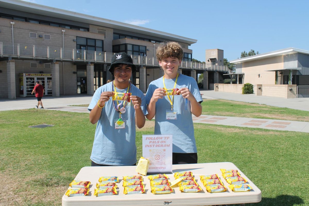 PALS gave out snacks and VG Donuts during the walk last Saturday. Left to right - Andres Sotelo (12), Noah Gaconnet (10)