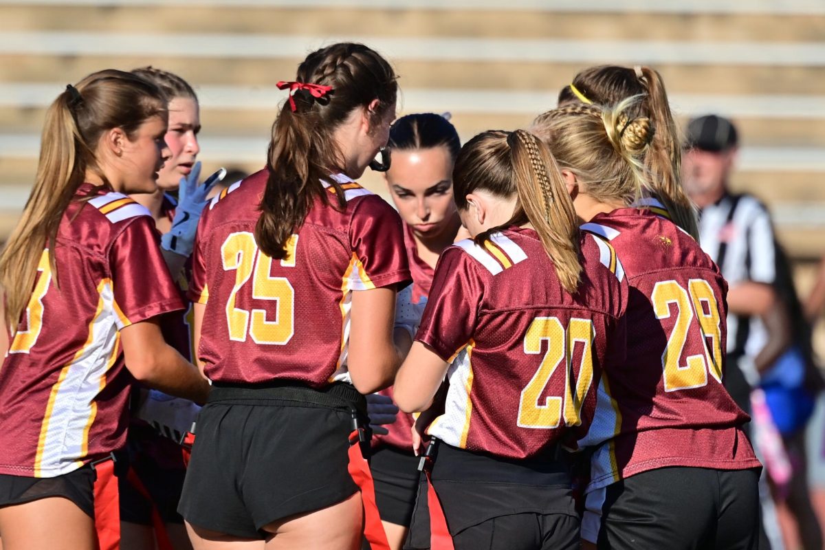 The varsity flag football team huddles up on Sept. 10, as they take on Mira Mesa High School. The team lost after a score of 8-9. Photo courtesy of Anna Scipione. 