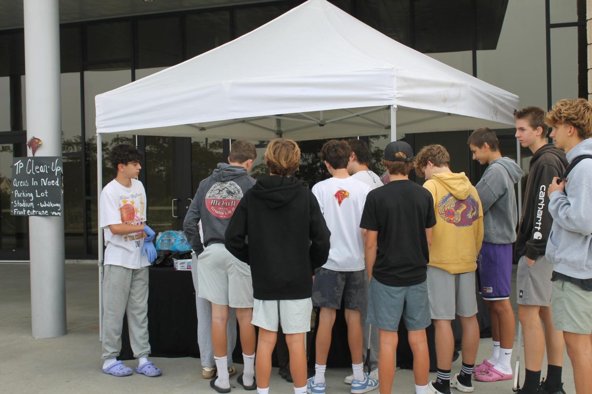 Volunteers line up in front of the foundation booth to grab supplies. The event turned out to be a major success.