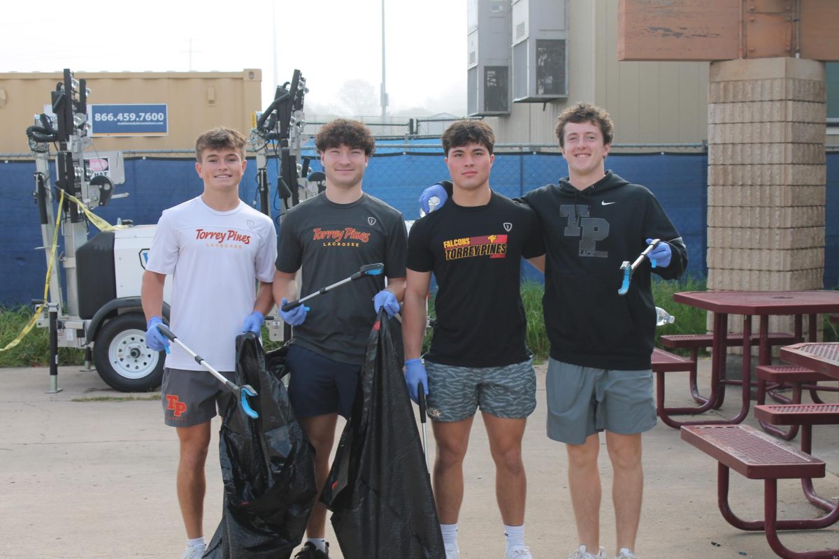 Students from the school's lacrosse team help clean the campus. Various student groups participated in the event. Left to right: Reid Habas (12), James Wenger (11), Foster Huang (11) and Bridger Stockton (11).