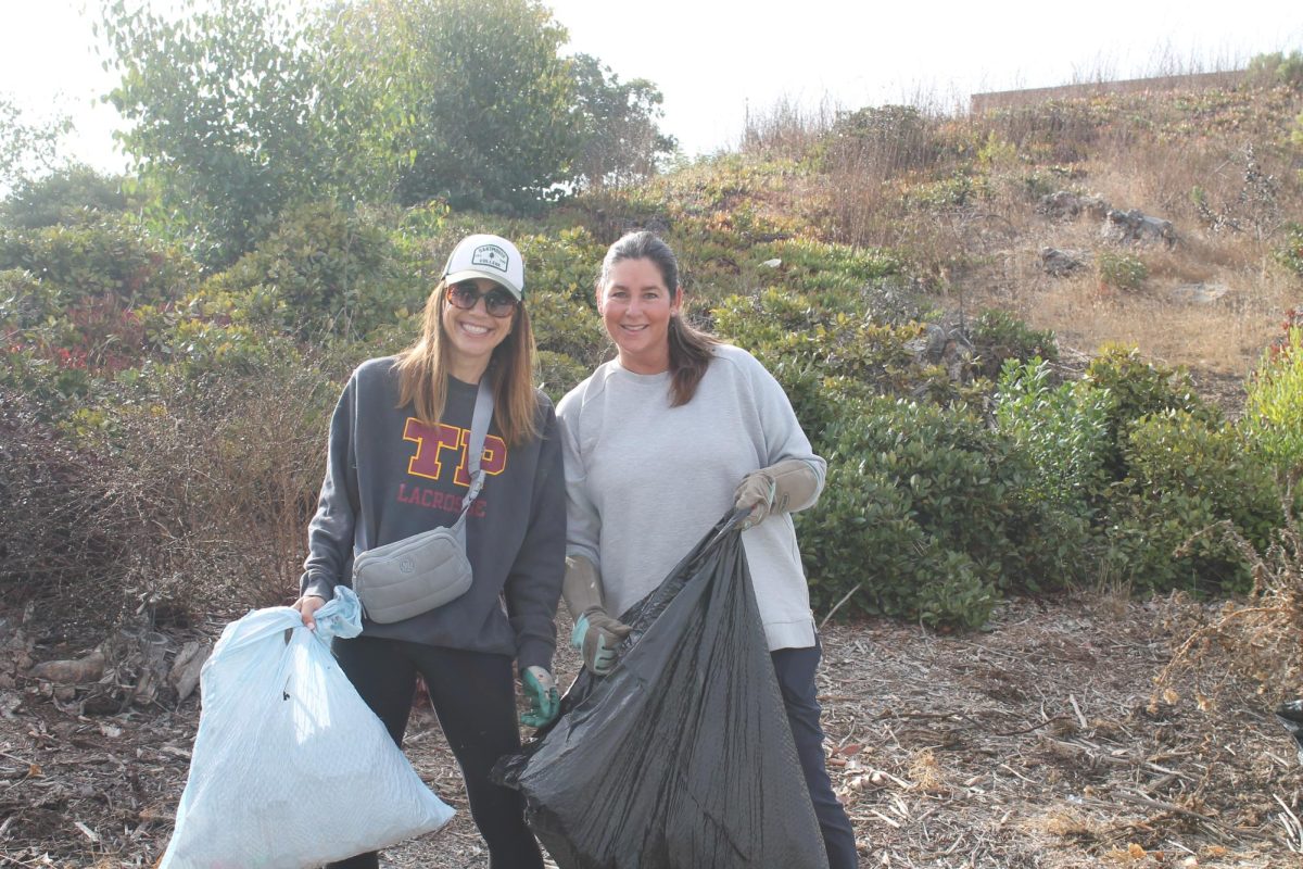 Parent volunteers work on areas surrounding the Performing Arts Center. Many parents, along with other community members, participated in the event.