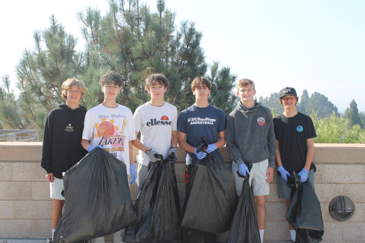 A group of students help collect trash around the English building. The campus cleanup experienced one of the best turnouts so far. Left to right: Cole Sozinho (9), Will Kenney (9), Ali Hussainy (9), Cade Sozinho (9), Jake Katz (9) and Adam Samhat (9).