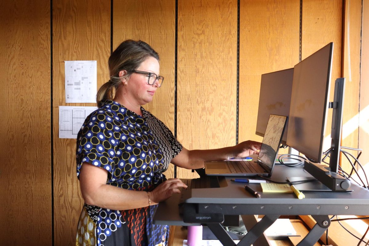 After arriving on campus, Lauren Chambers begins work on her computer. Chambers' experiences as a kindergarten teacher in 2005 inspired her to become a school psychologist.