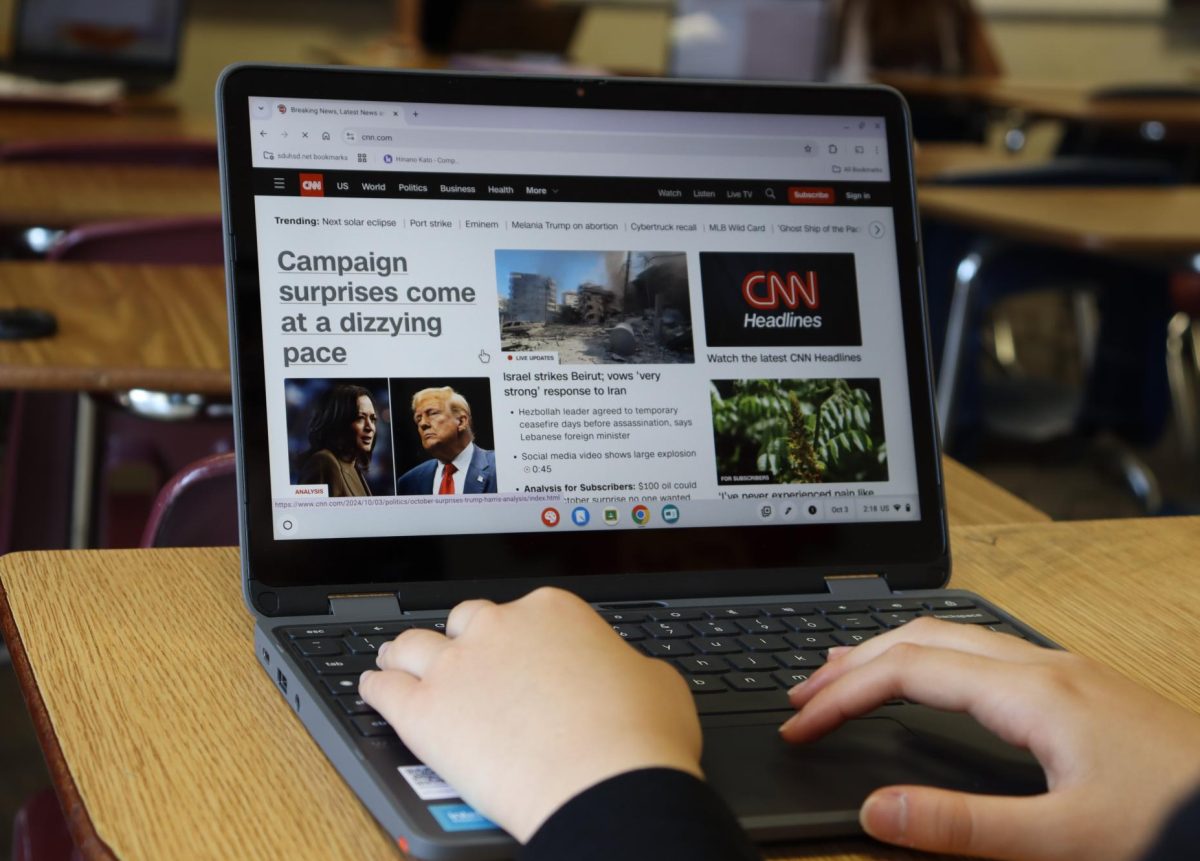 A student browses CNN on their Chromebook, preparing to click on a story. In recent years, younger generations faced with more social media bias over traditional platforms. 