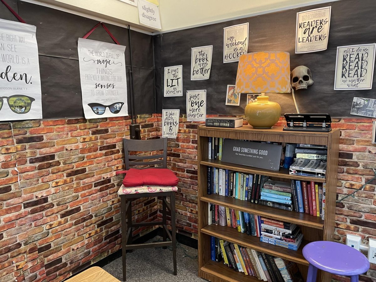 Education Specialist Monetta Hare co-teaches English 9 with English teacher Marie Black in this classroom. Cozy light illuminated the creative messages and bookshelf in the corner.