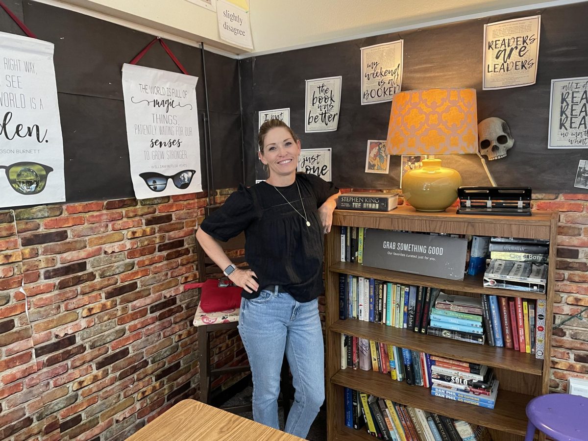 Education Specialist Monetta Hare co-teaches English 9 with English teacher Marie Black in this classroom. Cozy light illuminated the creative messages and bookshelf in the corner.