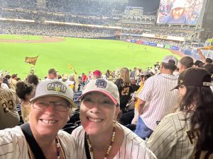 Left to right: Teachers Julie Neubauer and Catherine Mintz smile at the camera as they cheer on the Padres at Petco Park. The Padres ended their regular season 93 - 69, defeated by the Los Angeles Dodgers 3 - 2 in the National League Division Series. Photo courtesy of Catherine Mintz.