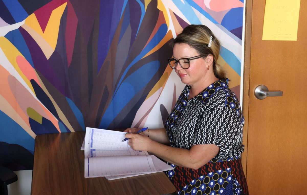 School psychologist Lauren Chambers sorts through paperwork in her office. Chambers started her work in the district in 2017 and assumed her position at the school this year. 