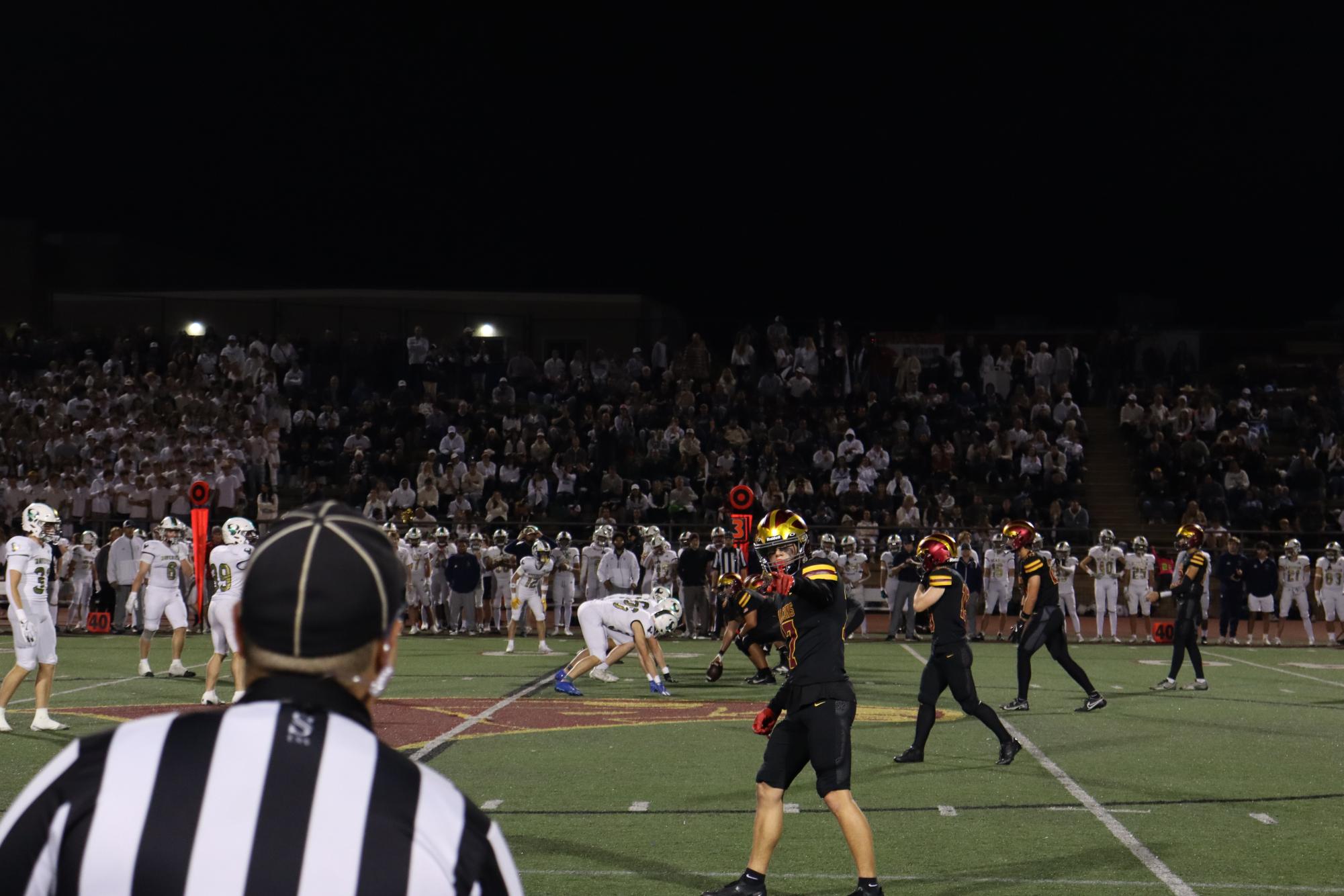 The varsity football team (4-6) lines up for a play against La Costa Canyon High School (10-0). The Falcons fell to their long standing rivals, the Mavericks, on Friday night with a final score of 28-0. 