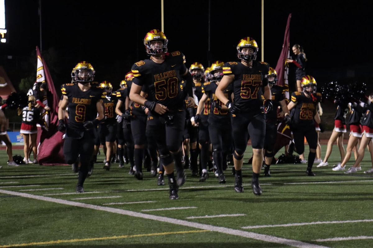 During halftime, the varsity football team (4-6) runs out ready to compete. The varsity football team (4-6) lost to the Mavericks after a score of 28-0. 