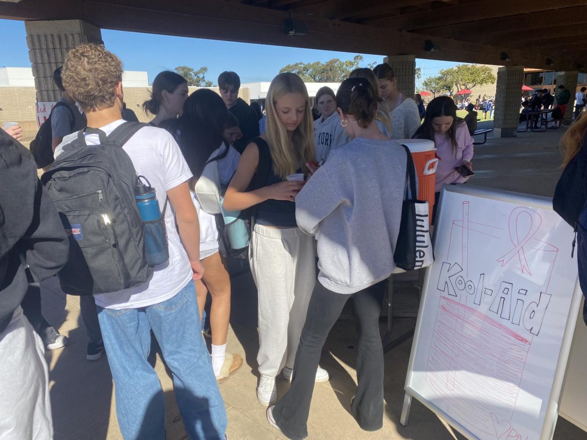 Students line up to receive Kool-Aid from PALs. Distributing Kool-Aid last Friday lunch was one of various events hosted by PALs for Red Ribbon Week that took place from Nov. 4 to 8.