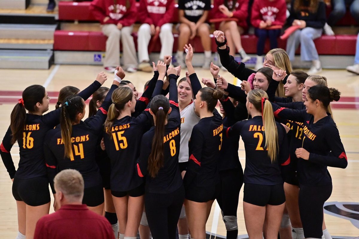 The varsity girls volleyball team (28-8) kicks off their match with their huddle and cheer. They competed in the CIF Open Division Championship on Saturday against Cathedral Catholic High School. Photo courtesy of Anna Scipione. 