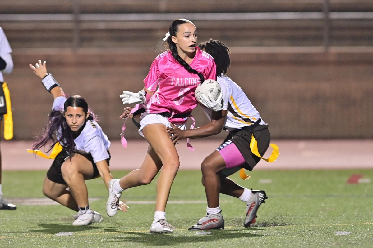 Presley Garcia (11) jukes out the El Camino defense. Garcia was named the November female Athlete of the Month. Photo courtesy of Anna Scipione. 