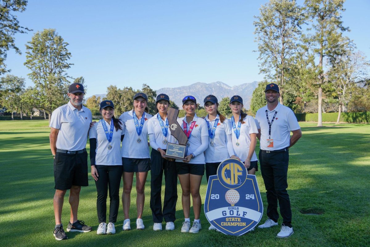 Left to right: Chris Drake, Tynaa Jacot, Alice Koontz, Zoe Salinas, Kate Hu, Zoe Jiamanukonnkit, Sehee Sim and Joe Rokoszewski pose after winning the CIF Division I State Championship. The last time the team won states was 11 years ago. Photo courtesy of SCGA.