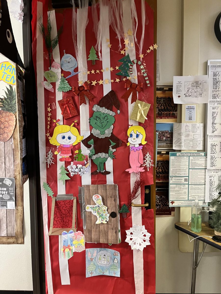 World History and AP Art History teacher Lisa Tellers' door presents the characters of 'The Grinch.' The door was also decorated with stars, ribbons and other objects that represented the winter holidays.