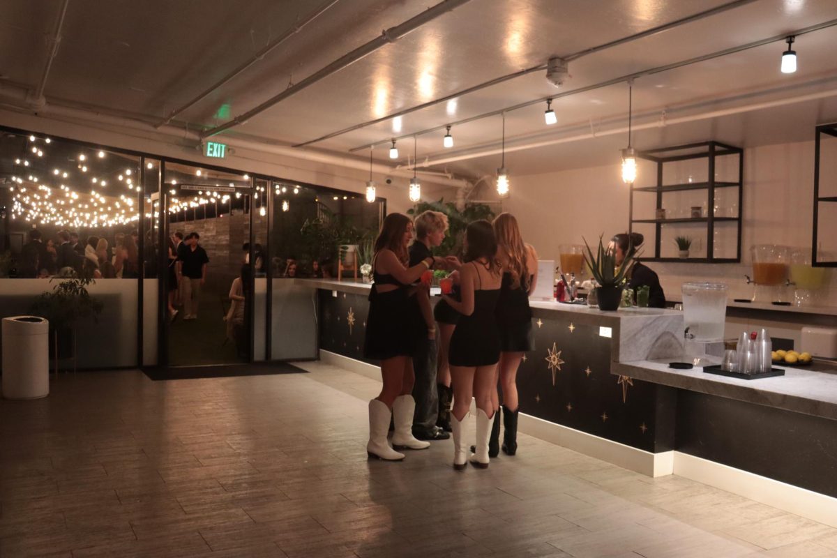 Students enjoy drinks provided at the venue. Winter formal took place on Jan. 25. 