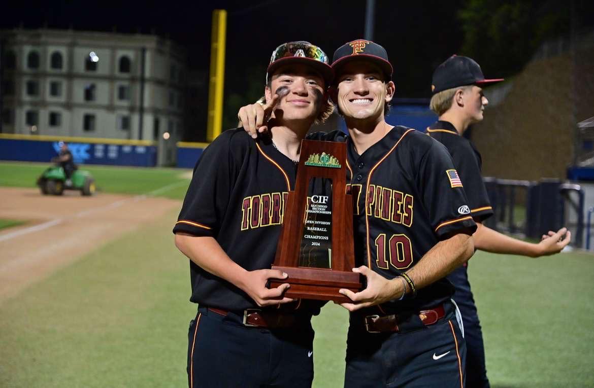 Left to right: Riley Tone (12) and Thomas Maher ('24). Student manager Tone holds up the 2024 CIF Open Division trophy with Maher. Tone became a manager for the boys varsity basketball and boys varsity baseball team after suffering an ACL tear  his freshman year. Photo courtesy of Riley Tone.