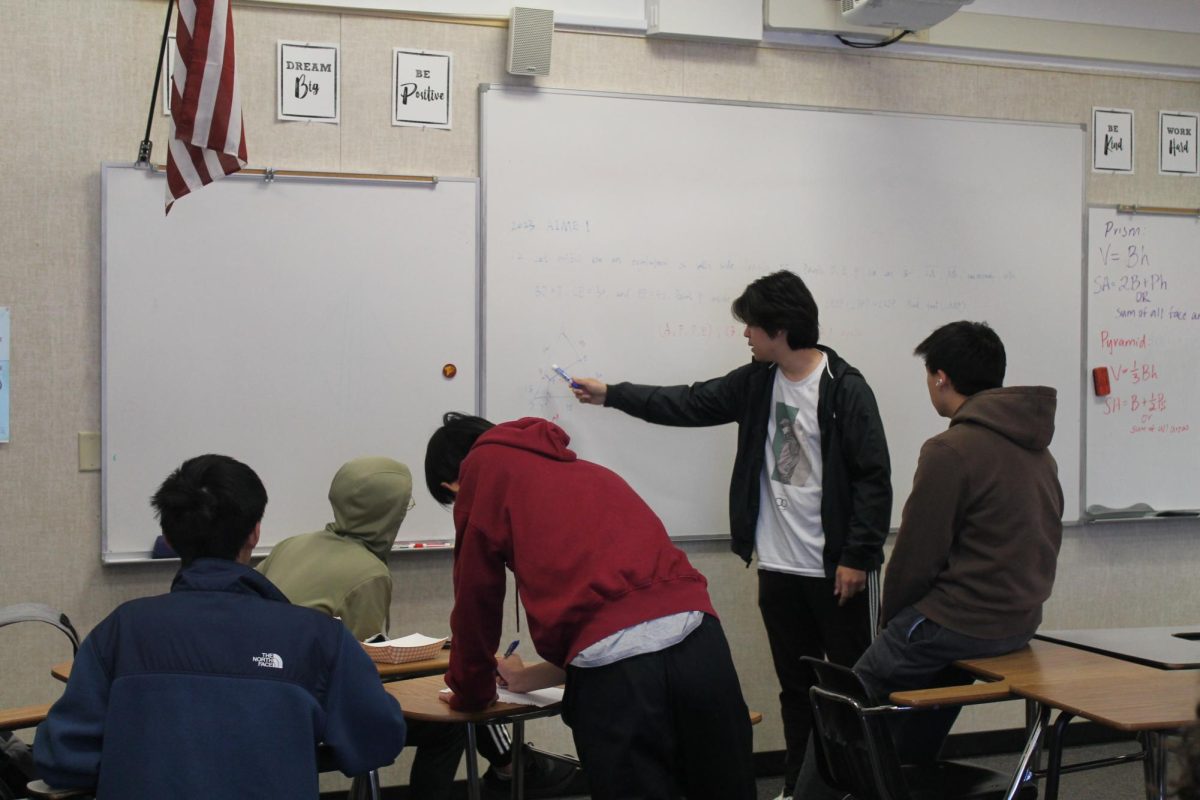 The Math Club gathers every Wednesday at lunch and solves past American Invitational Mathematics Examination problems in preparation. Nine students qualified for the AIME after taking the American Mathematics Competition last November. Left to right: Chris Chen (9), Jian Kun Yu (11), Alex Chen (9), Xinyu Meng (12) and Eric Xie (11).