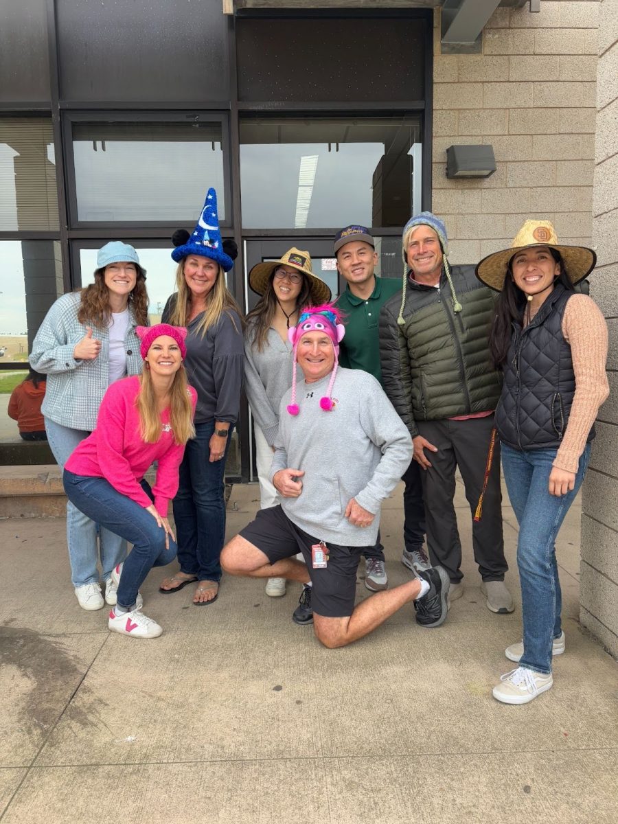 Math teachers pose for Day 4 of Staff Dress-Up Week. From cowboy hats to helmets, unique hats were seen around campus. Photo courtesy of Josh Mihalinec.