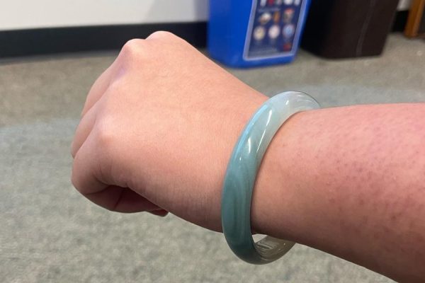 Evelyn Tran (12) wears a jade bracelet on her left wrist. Tran's mother brought her the bracelet from Vietnam. Photo Courtesy of Evelyn Tran. 