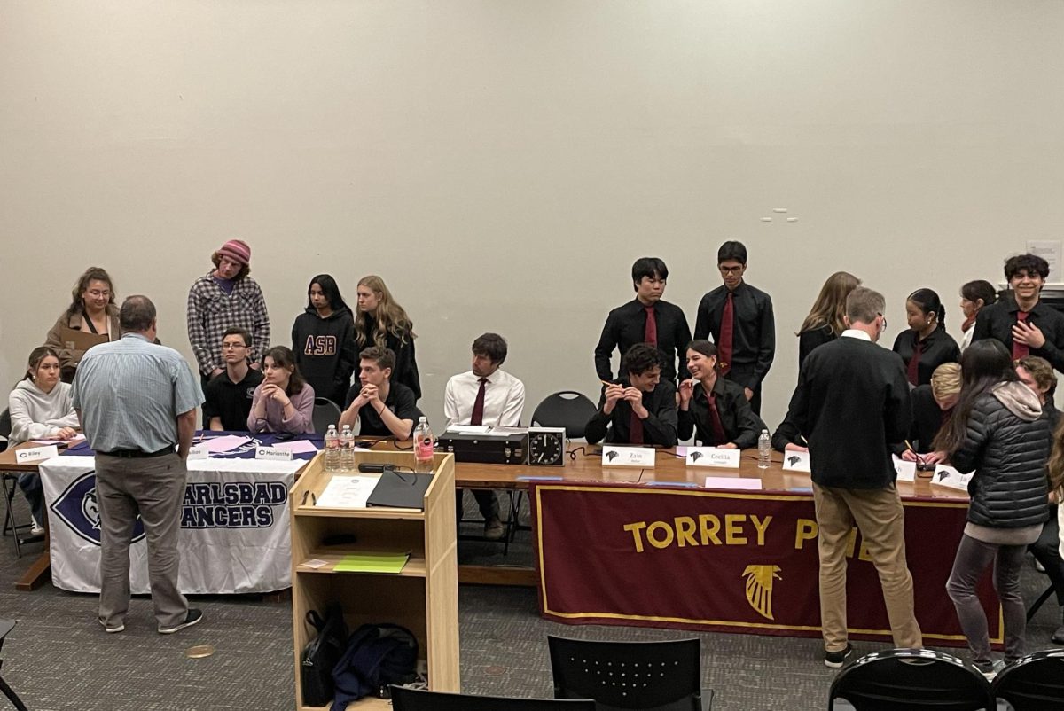 The varsity Academic Team prepares for their match against Carlsbad High School. The match was held on Jan. 30, with the Falcons falling 86-30. 
TPHS back row left to right: Kei Tashiro (12), Eamon Moore (12), Chloe Clements (11), Joy Ma (12) and Matias Chinchilla (12). TPHS front row left to right: Zain Mehio (12), Cecelia Colangeli (11), Collier Lawson (11), Zach Dawson (12) and Jack Sheehy (12).