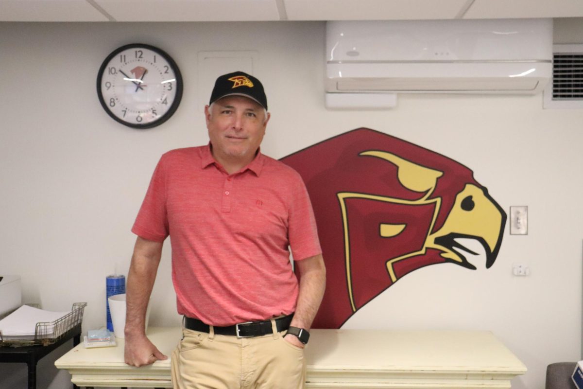 Nathan Molina poses in his new office. Molina joined the administration team on Feb. 7 as the new assistant principal, following the promotion of former assistant principal Robert Shockney to a district position.  