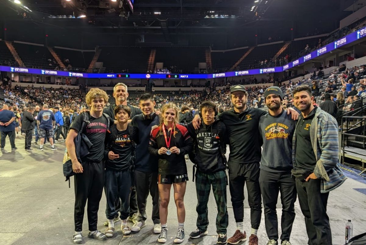 The varsity wrestling team stands together for a photo at the CIF State Wrestling Championship. This was the first time the team had five wrestlers qualify for state, the most in program history. Left to right: Jake Sakofsky (12), Michael Bigrigg, Jacob Cava (12), Mahiro Okazaki (12), Ruby Julien-Newsom (12), Carter Bolt (11), Cory Brennan, Paulo Dominice and Adan Pacheco. Photo courtesy of Jacob Cava.