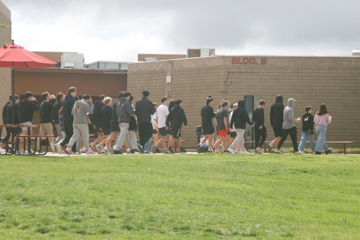 Students and other participants walk in recognition of National Eating Disorder Awareness Month. The NEDA Walk, hosted by PALs, took place on March 1.