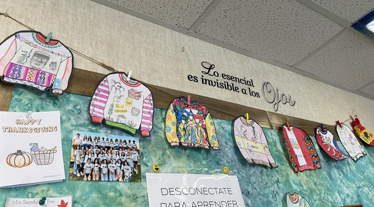 Ugly Christmas sweaters themed around spanish-speaking countries line the walls of Spanish teacher Viviana Alvarado's classroom. Alvarado incorporated many art projects, including painting holiday snow globes and making papel picado into the Spanish 4 and AP Spanish curriculums. 