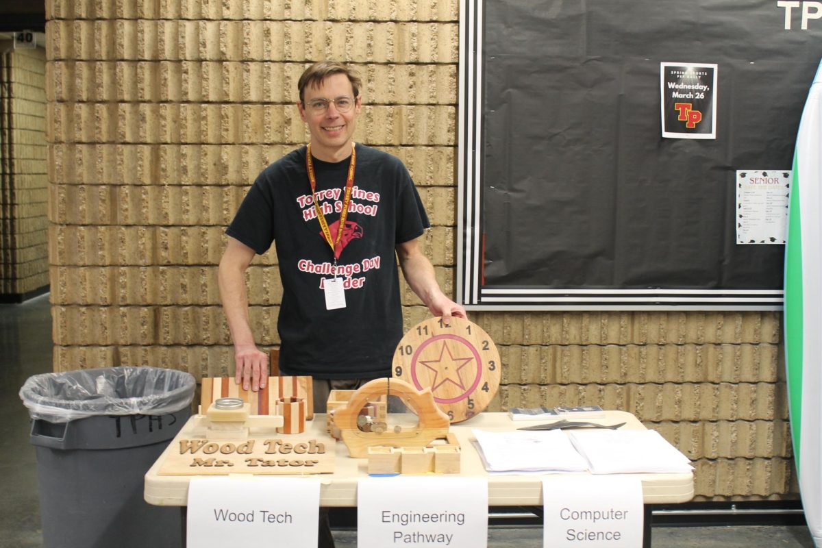 Various wood crafts decorate AP Computer Science Principles and Intro to Engineering Techniques teacher Brinn Belyea's table. Wood Tech, the engineering pathway and computer science classes were promoted to the incoming freshmen. 