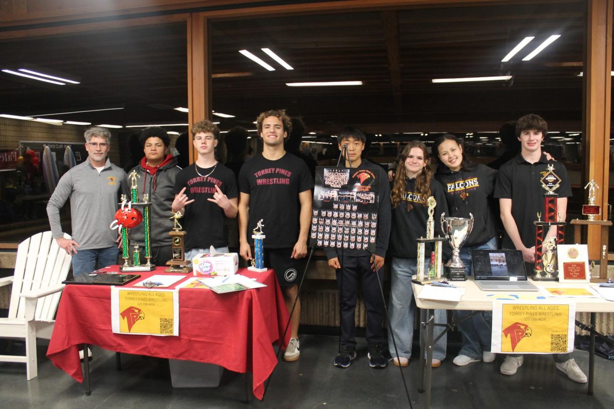 The wrestling team showcases their program. Wrestling was one of the many sports booths that attracted interest, with many people signing up. Left to right: Citi Bongo (10), Tye Fernandez (9), Marko Dzodzo (11), Ruby Julien-Newsom (12), Amelia Brown (10) and Gavin Gross (11). 