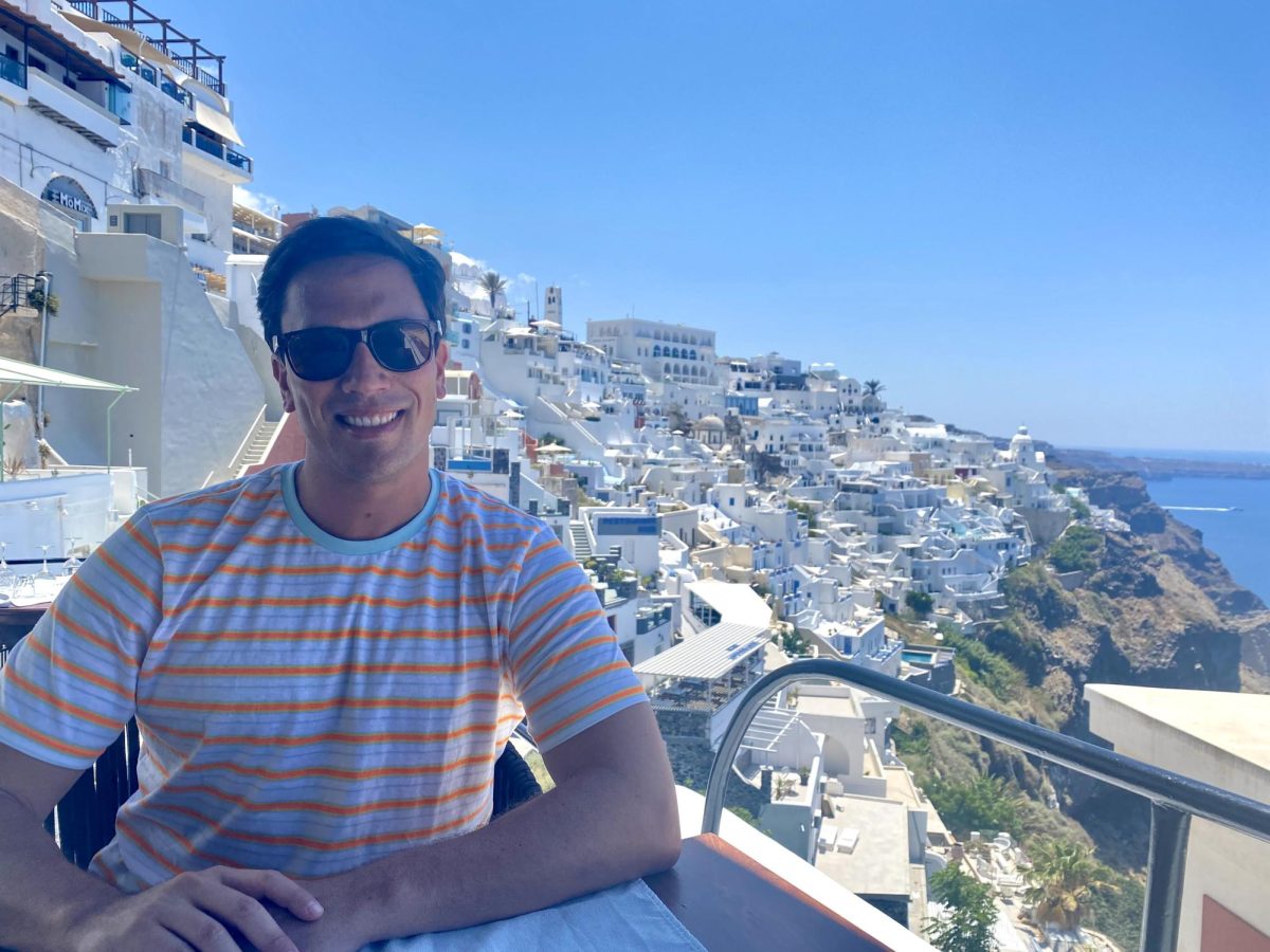 English 11 teacher and Yearbook adviser Brandon Keller visits the iconic blue and white buildings of Santorini, Greece. Many of his travel destinations were inspired by past students. Photo Courtesy of Brandon Keller. 