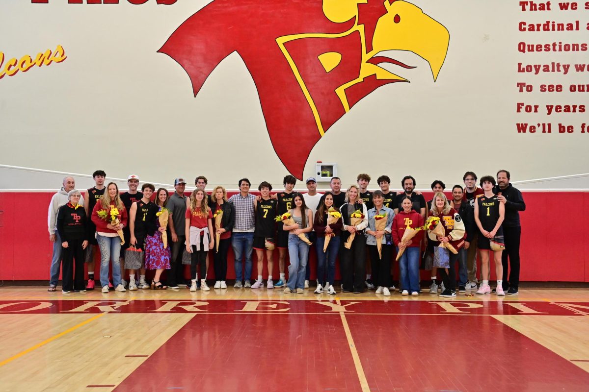 The varsity boys volleyball team (30-6) takes a picture with family and friends, celebrating their senior night. On April 29, the Falcons took home a win against Poway High School (23-16). Photo courtesy of Anna Scipione. 