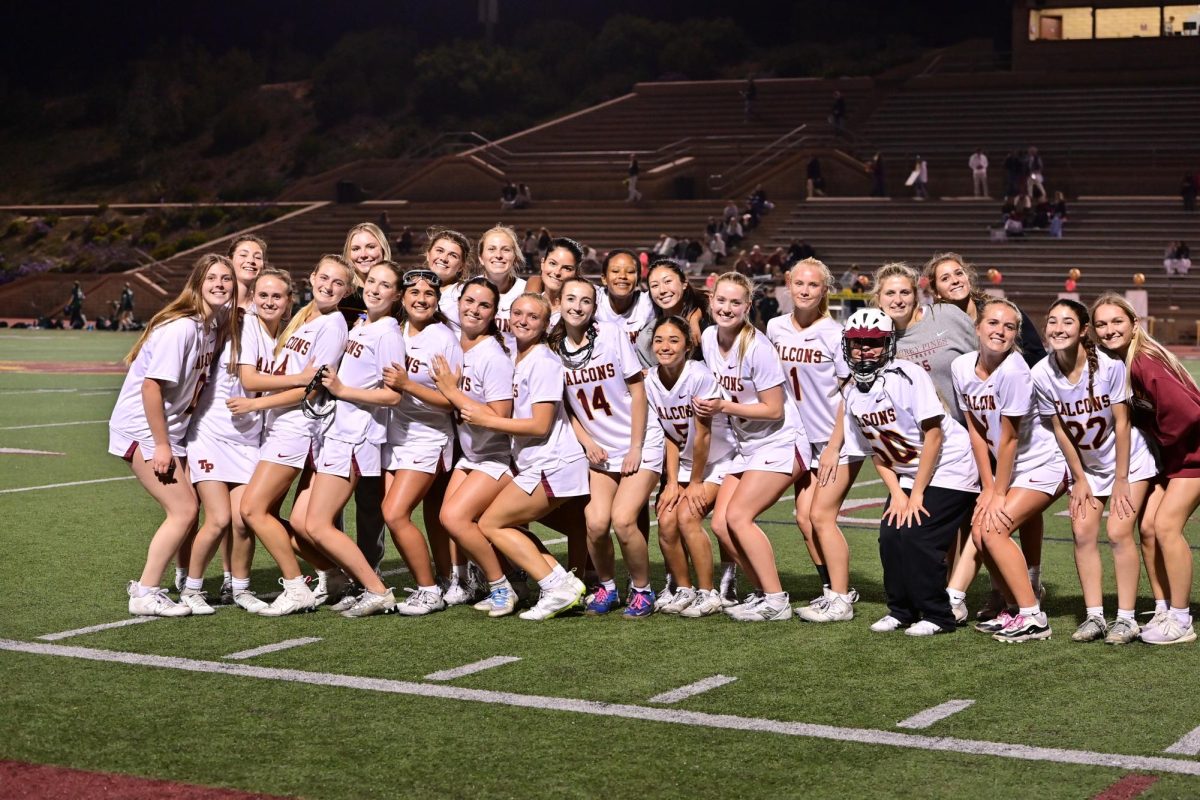 The girls varsity lacrosse team (6-11) team smiles for a picture on Senior Night. The Falcons dominated, defeating Poway High School (6-17) 20-5 on Tuesday. Photo courtesy of Anna Scipione. 