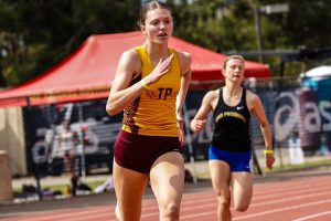 Emery Gonzales (10) sprints ahead, finishing off her race. Gonzales was named Aprils female Athlete of the Month. Photo courtesy of Emery Gonzales. 