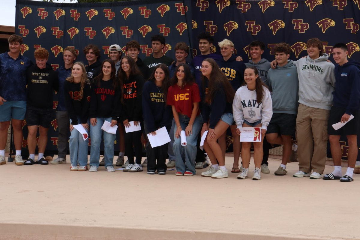 Seniors committed to play their sport at the next level line up for a group photo. This year, 21 seniors attended the ceremony. Left to right back row: William Schreckengaust (12), John Prior (12), James Curtis (12), Joey Levenberg (12), Tommy McCool (12), Cole Loizu (12), Brody Martin (12), Samuel Violett (12), Cody Shen (12), Jack Swanberg (12), Ethan Elleraas (12), X, Tomi Anderson (12) and Aidan Jennings (12). Left to right front row: Sydney Stewart (12), Sydney Meltzer (12), Kelly Whelihan (12), Eva Gutierrez (12), Edra Bello (12), Sam Herman (12) and Emma Schreuder-Welte (12).