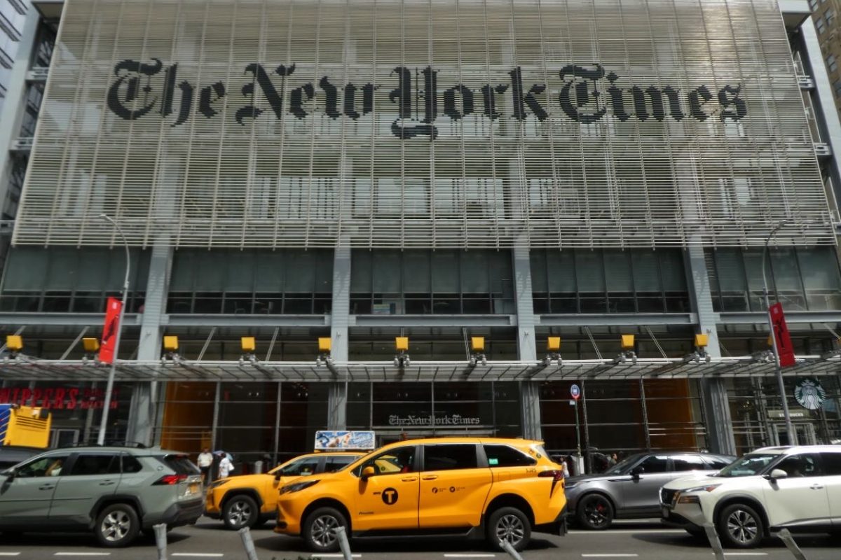Christopher Bacon (10) visits the New York Times building as part of the summer academy program. Participants were able to observe journalists at work within the building.
