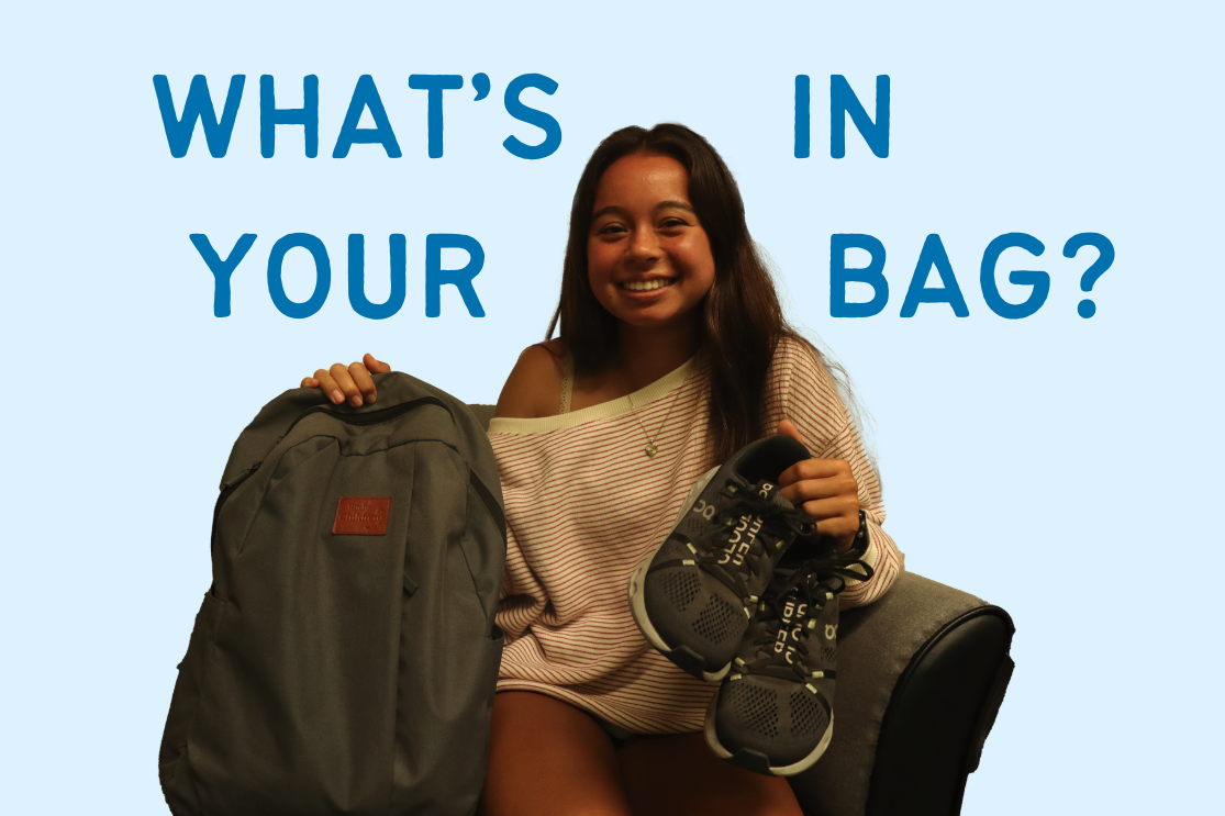 Sophie Lesser (12) holds up her backpack and On Cloud running shoes. The bag was a gift from her father, who has a matching backpack.