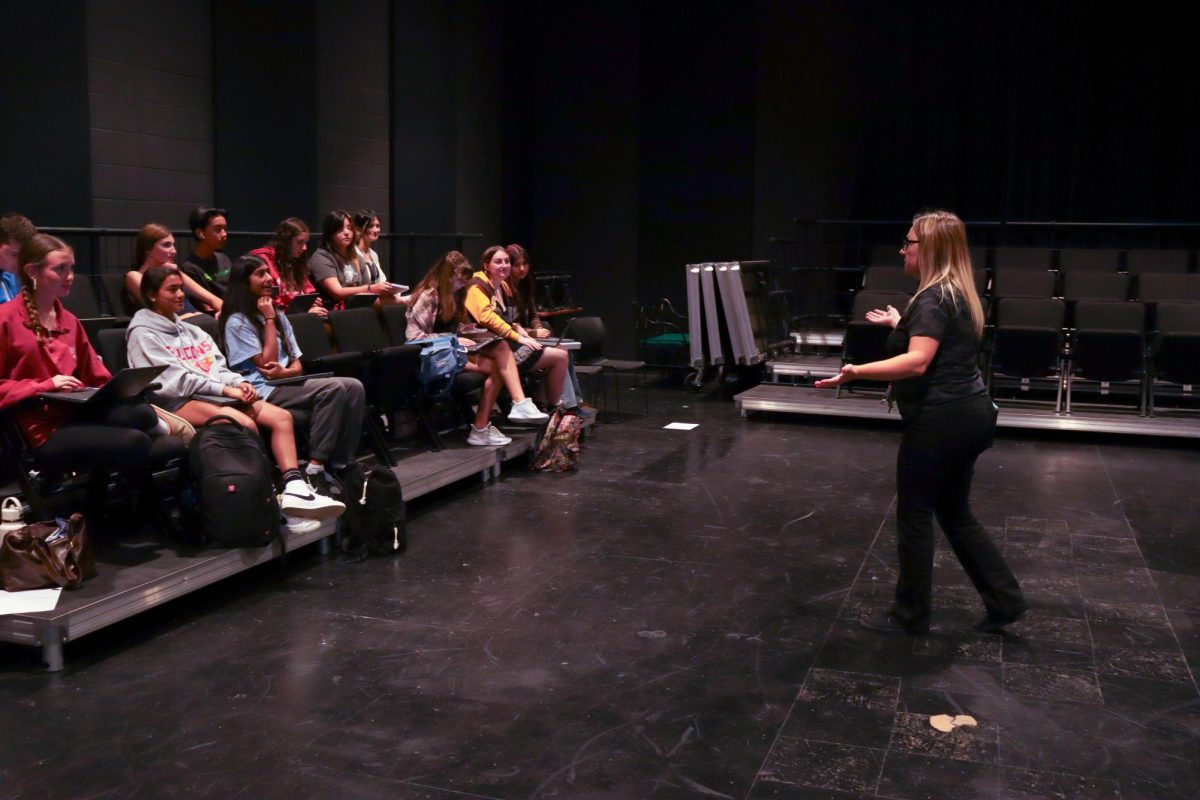 Theater teacher Sandra Geminiani describes an improv game to her Introduction to Professional Theatre students. Geminiani began teaching theatre classes, English 10 and AVID 10 at the school this year.