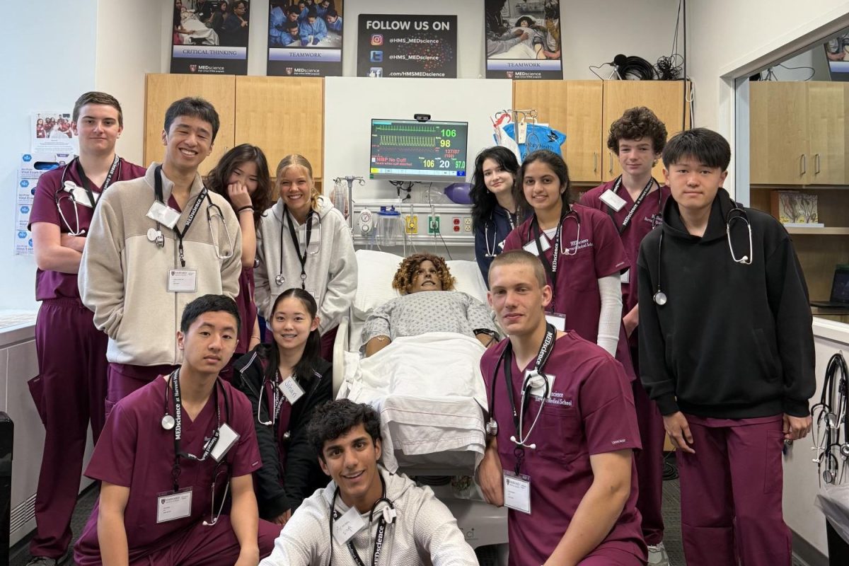 Lucy Crosby (10) and peers showcase a prototype of their own AI surgical robot, which allows them to solve complex medical problems. Crosby attended a five day med-tech program at Harvard Medical School, the MEDscienceTECH Moonshot. Photo courtesy of Lucy Crosby.